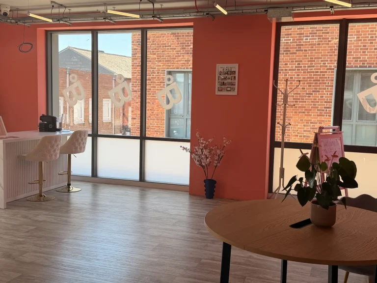 Round table and reception desk in the co-working entrance area